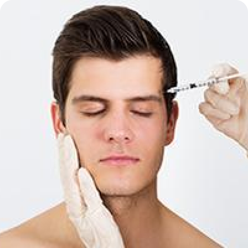 A man getting his face waxed by an esthetician.