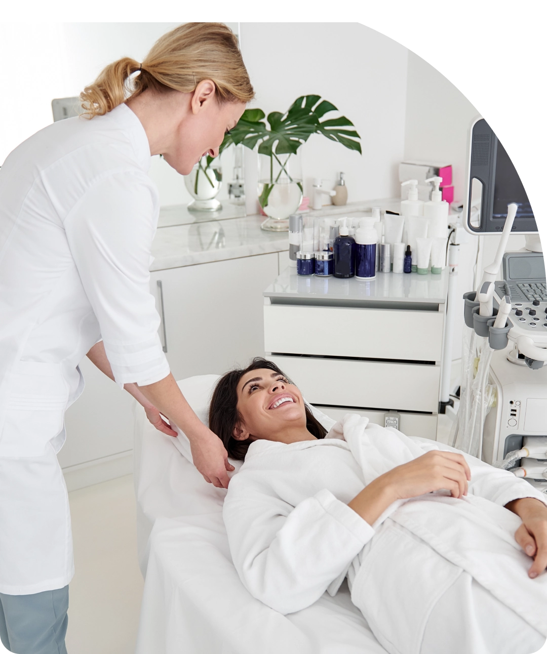 A woman is getting her hair cut by a nurse.